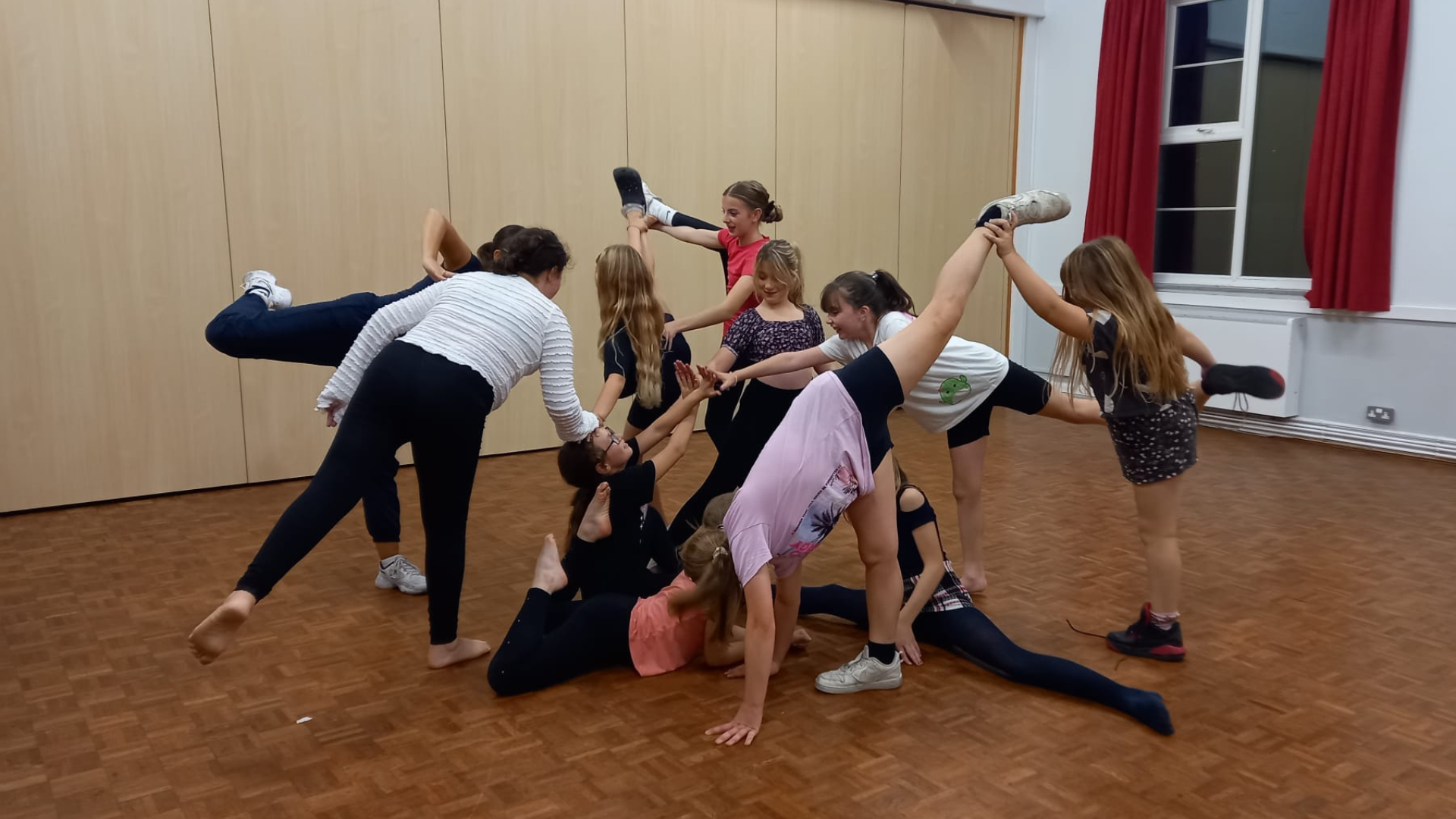 A group of children / teens holding a pose at a Turlin Moor Dance session