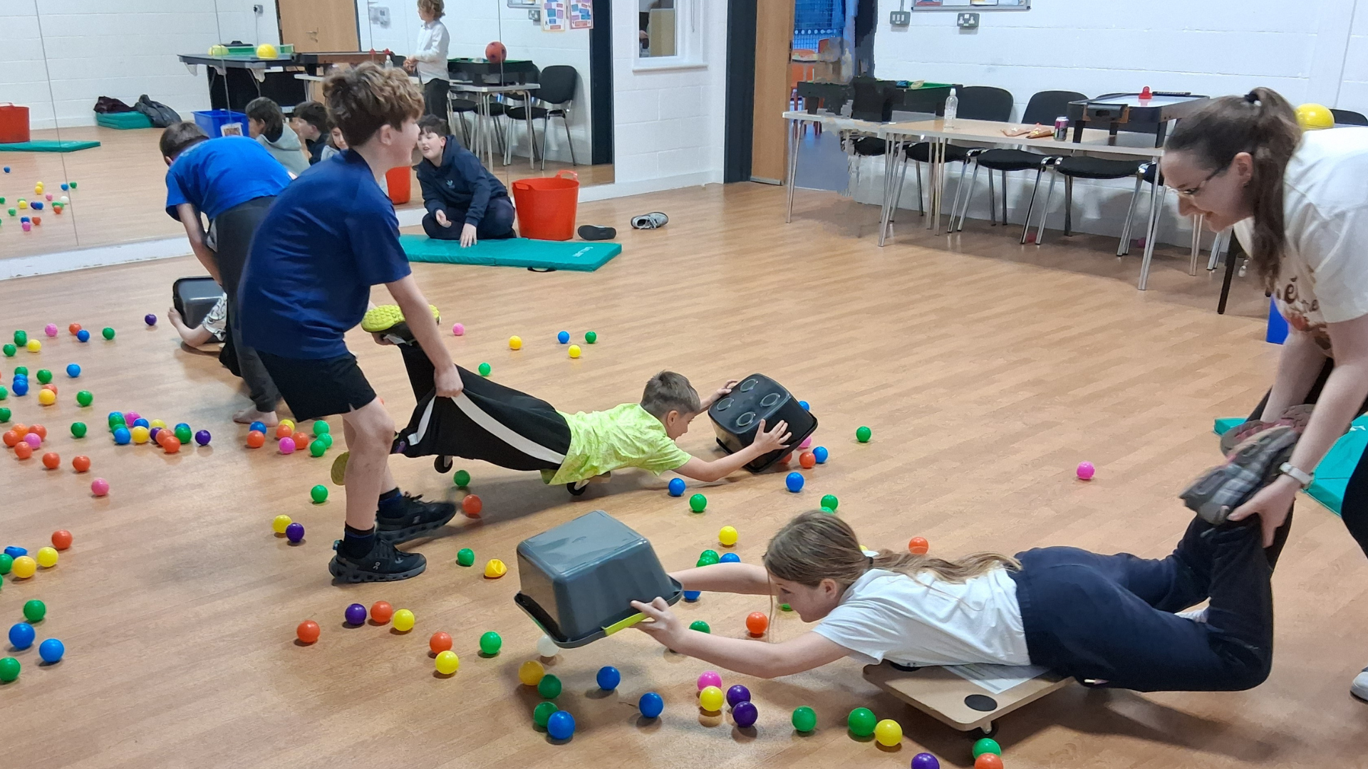 A photo of children playing a game in the hall at the bourne community hub